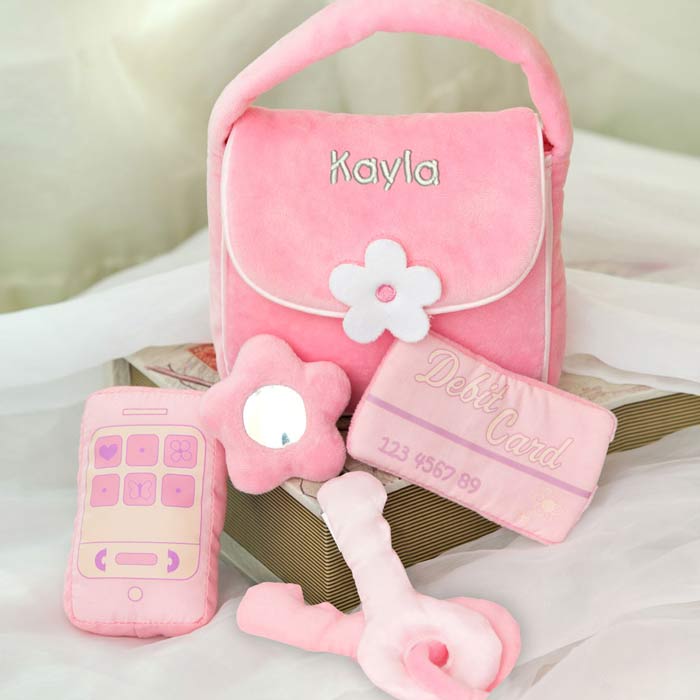 Add your babies name to this cute pink plush purse set for girls